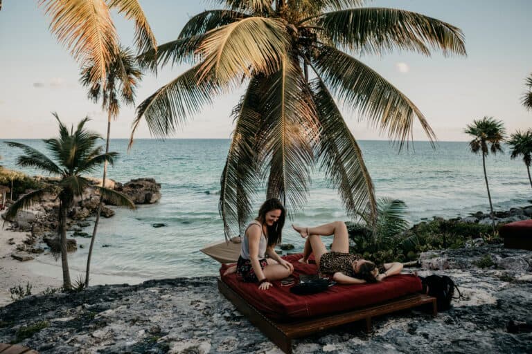 Travelers relaxing on the coast in Tulum, Mexico